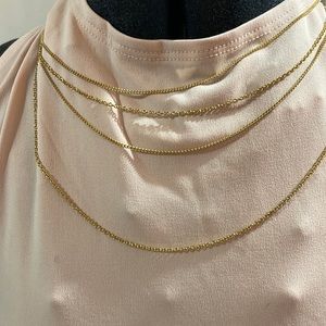 Artistry Four tier Gold tone chain.